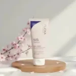 Flicka Silk Touch Milk Cream bottle on display from GlowMyst