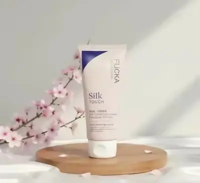 Flicka Silk Touch Milk Cream bottle on display from GlowMyst
