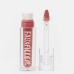 Huda Beauty Extra Shine Lip Gloss tube displayed cleanly on a surface